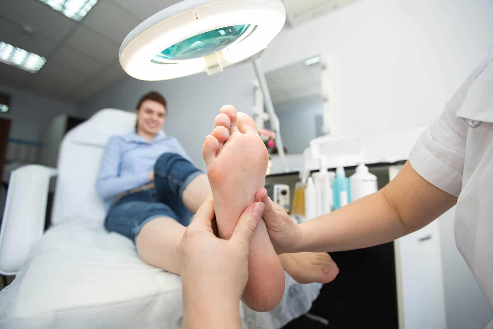 doctor holding foot